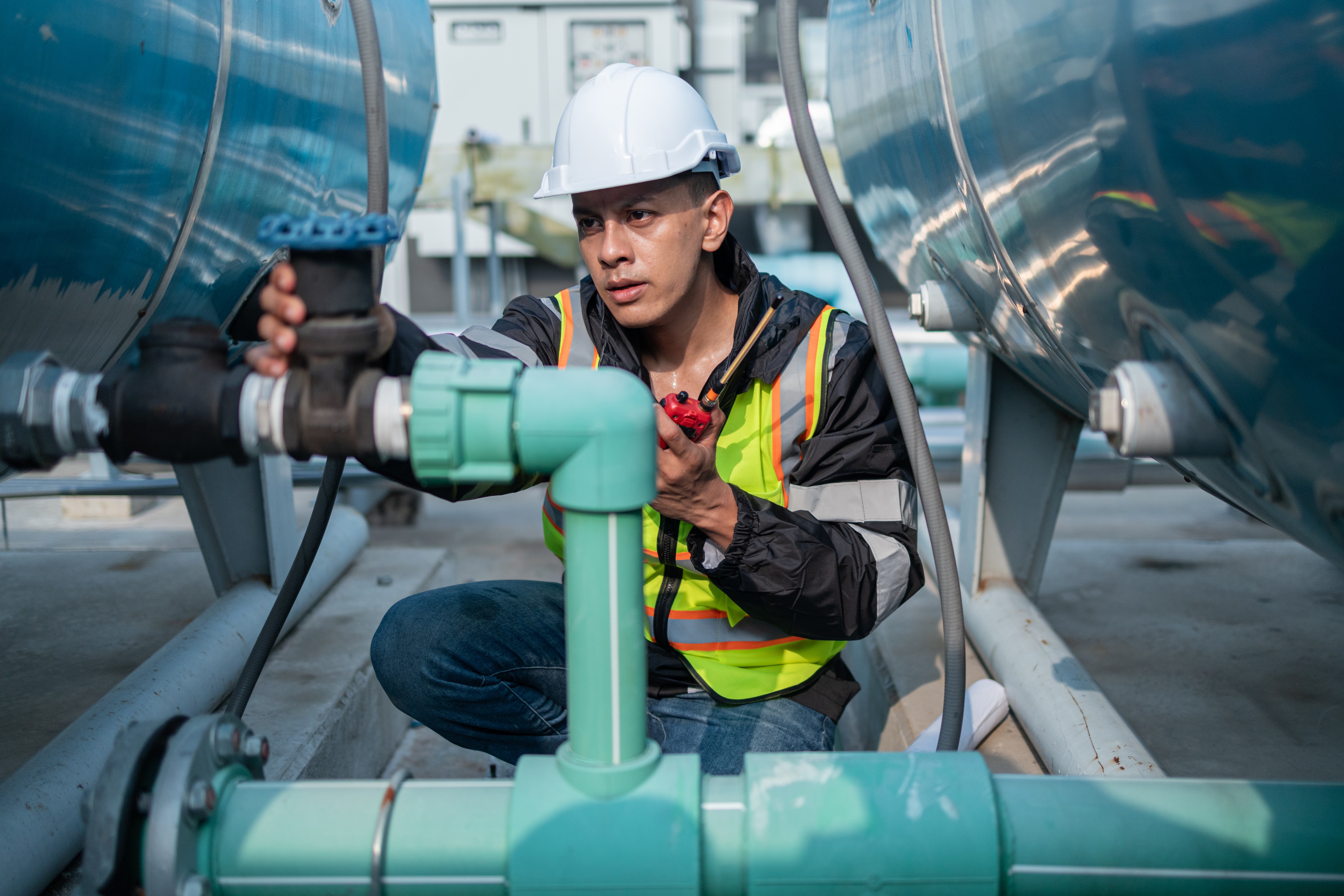 Engineer Inspecting Pipes