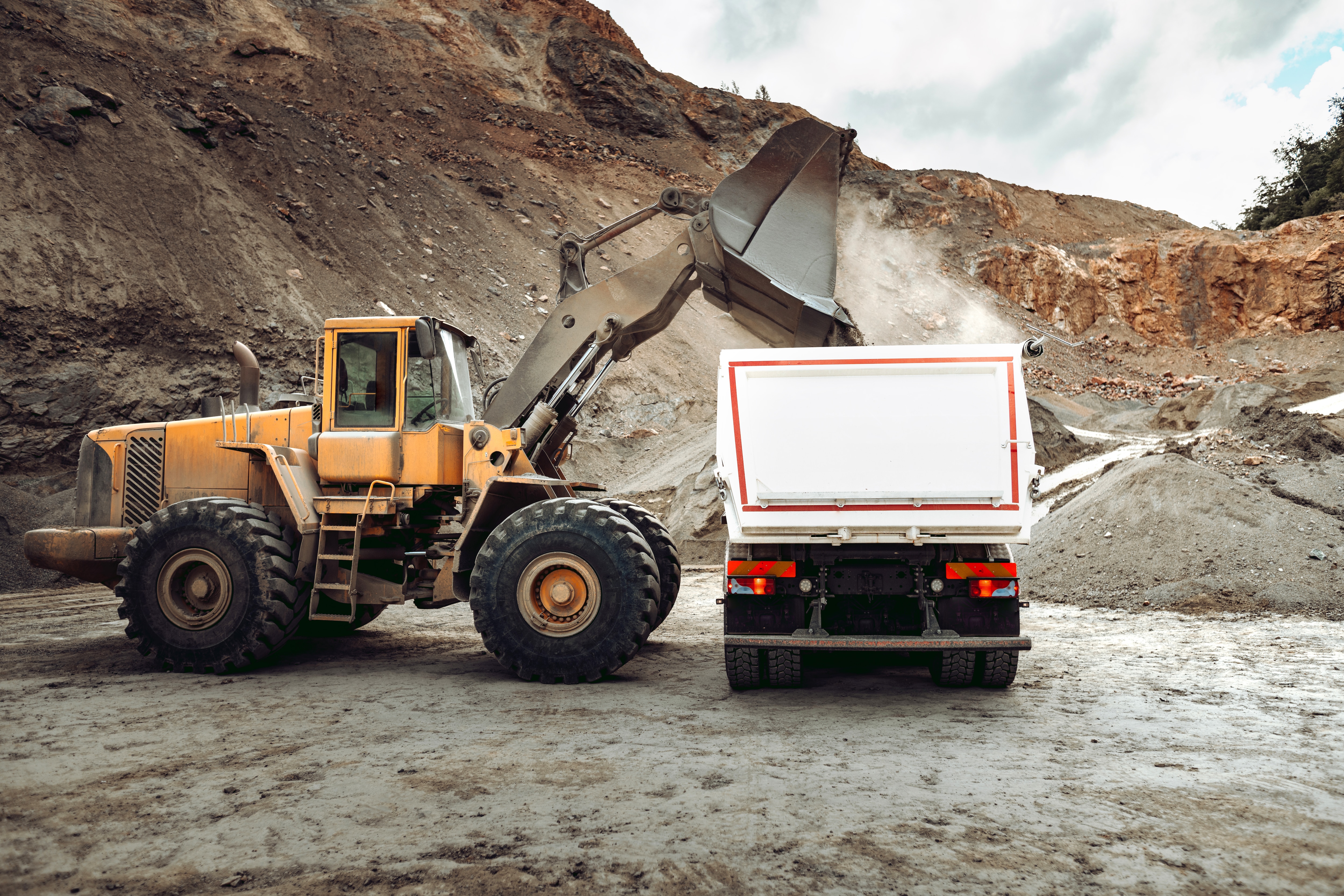 excavator-loading-a-dump-truck-in-quarry